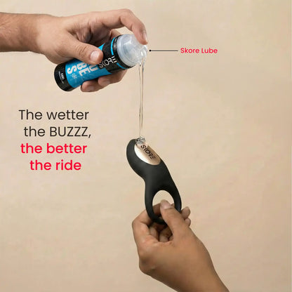 Applying Skore water-based lubricant to the Buzzz vibrating ring for a smoother experience.