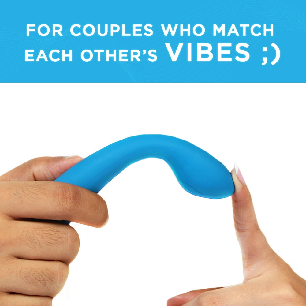 Skore VibHer flexible blue silicone vibrator bent by two hands showing flexibility for couples play