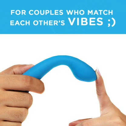 Skore VibHer flexible blue silicone vibrator bent by two hands showing flexibility for couples play